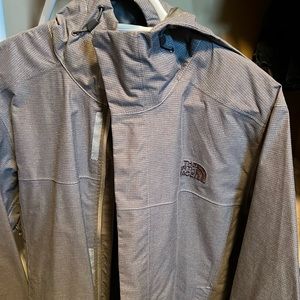 Gray ripstop size small men’s north face rain jacket.